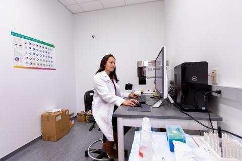 Researcher using Cytek Aurora Spectral Flow Cytometer