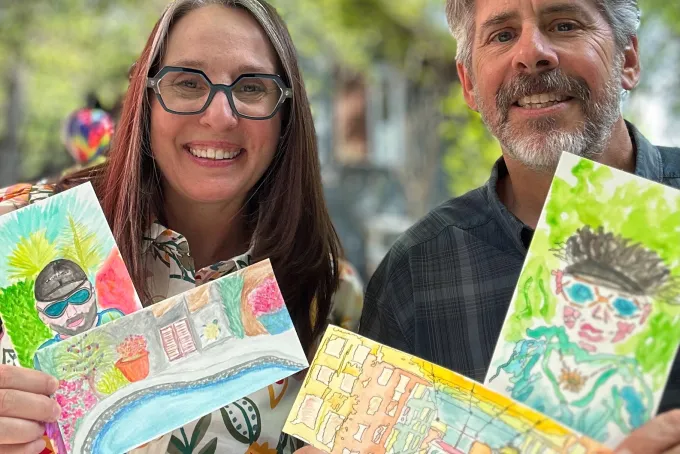 Tania Tost and her husband Paul show off some of their watercolors.