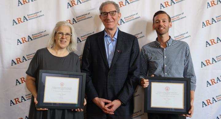 Lindy Aleshire, left, and Sean Schaffer, right, recipients of the 2024 Research Administrator Awards, pose with VPR Dan Jaffee, center